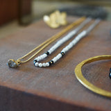 COLLAR TEJIDO BLANCO NEGRO GOLDFILLED