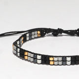 PULSERA TRINIDAD DOBLE NEGRA GRIS