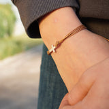 PULSERA CRUZ HILO CAFÉ NIÑO PLATA