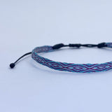 PULSERA TELAR DELGADA CELESTE-LILA NIÑA