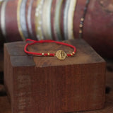 PULSERA SAN BENITO MOSTACILLAS ROJAS ENCHAPE ORO