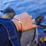 PULSERA SAN BENITO MOSTACILLAS ROJAS ENCHAPE ORO