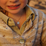 COLLAR TEJIDO VIRGEN CREMA