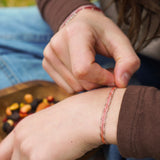 PULSERA TELAR DELGADA ONDAS ROSAS TEEN