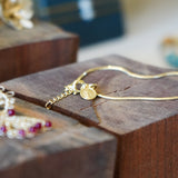 PULSERA M PAZ ENCHAPE ORO CON ACCESORIO